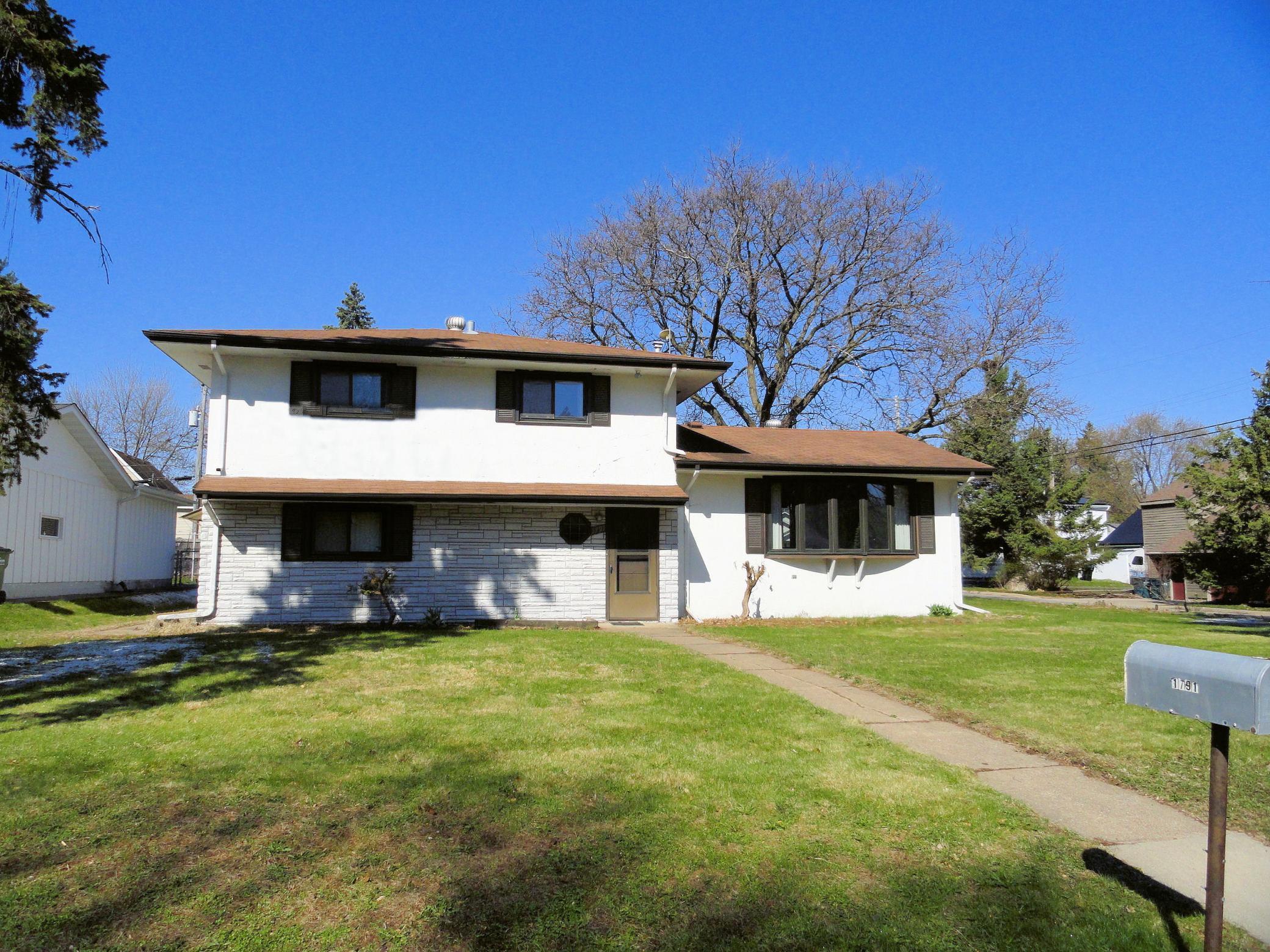 Attractive front entrance on a large corner lot. The appeal of a 2 story with a generous foyer for greeting friends.