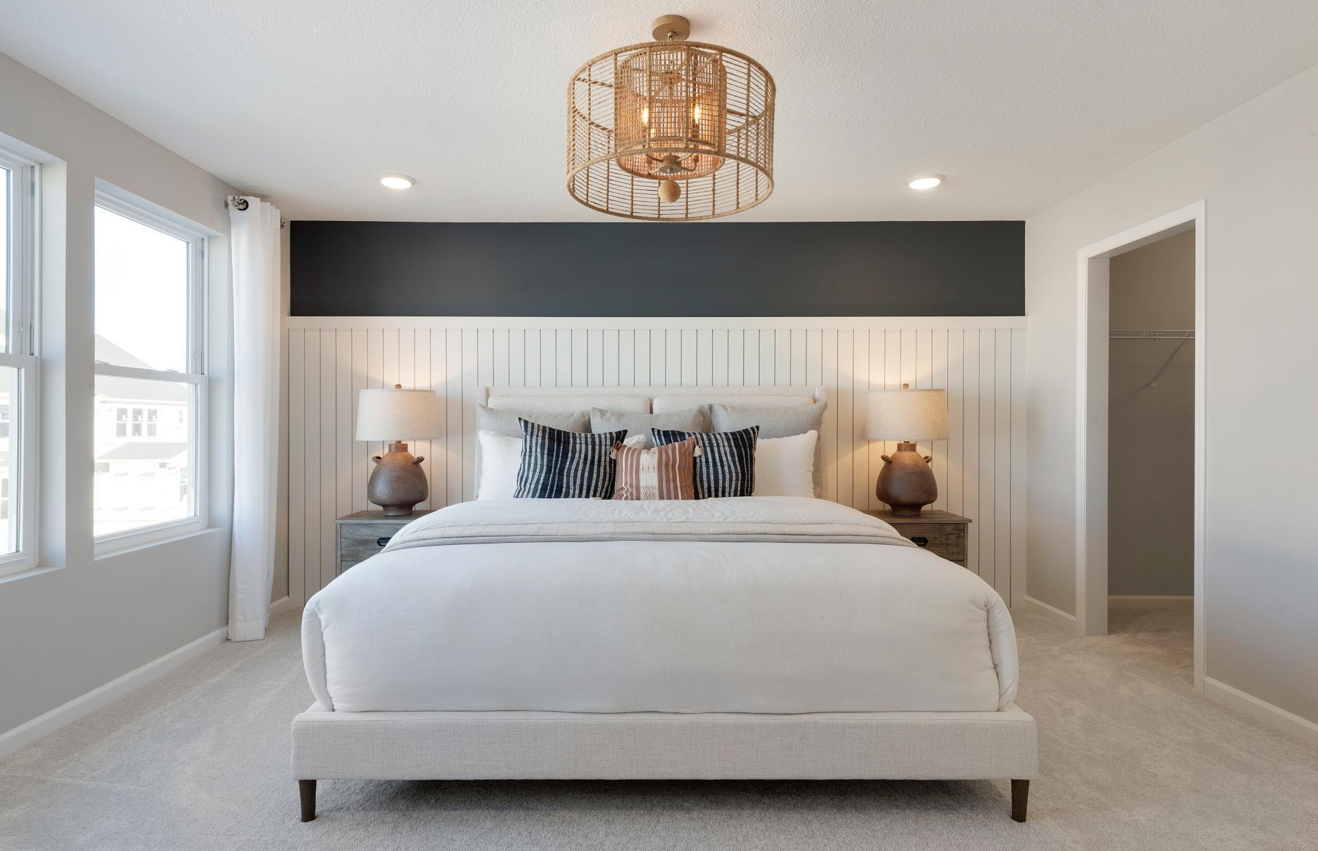 Welcome to the Primary Bedroom. The Ashton bedroom is a calming oasis and the perfect retreat at the end of the day! Photo of model home.