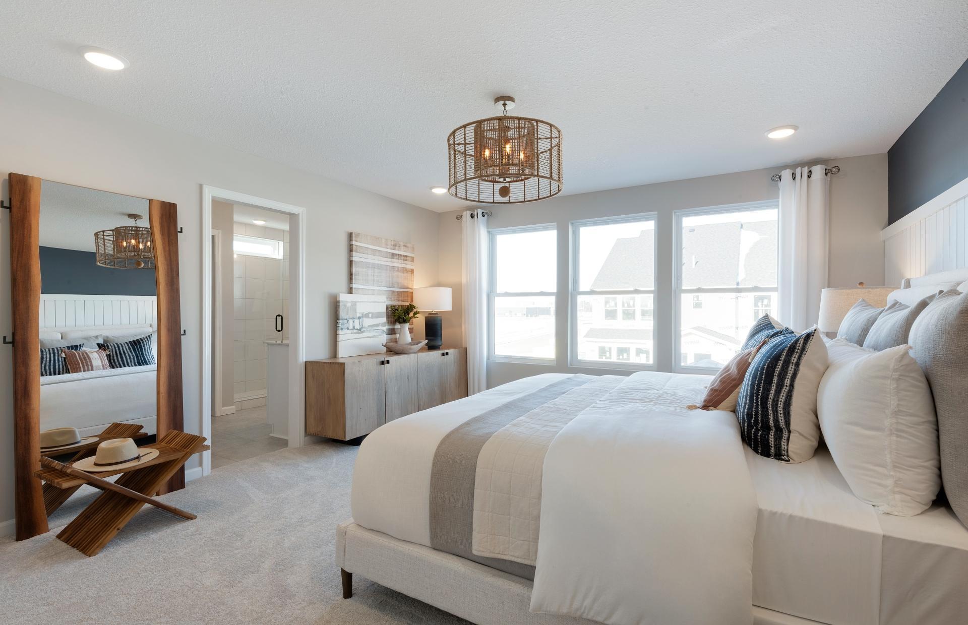 Huge windows and ample space make the Ashton Primary Bedroom one to remember! Photo of model home.