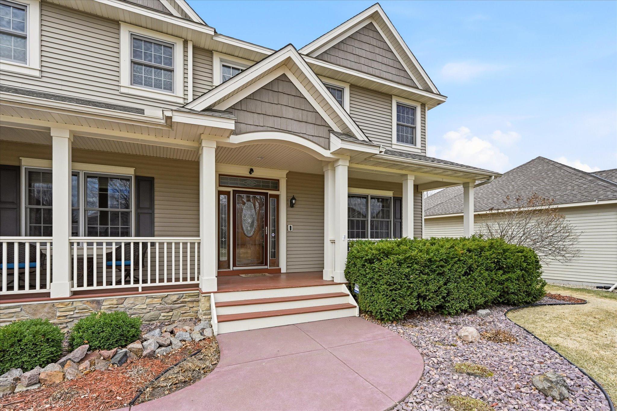 The large front porch beckons you to come and sit a while.