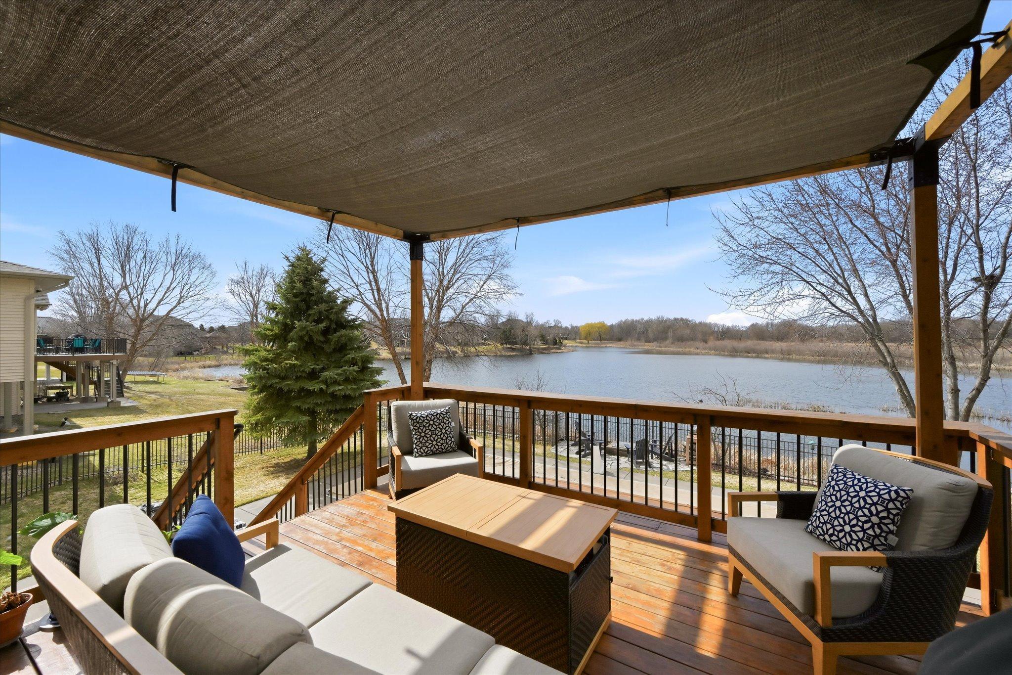 The covered deck creates a seamless indoor-outdoor living experience.