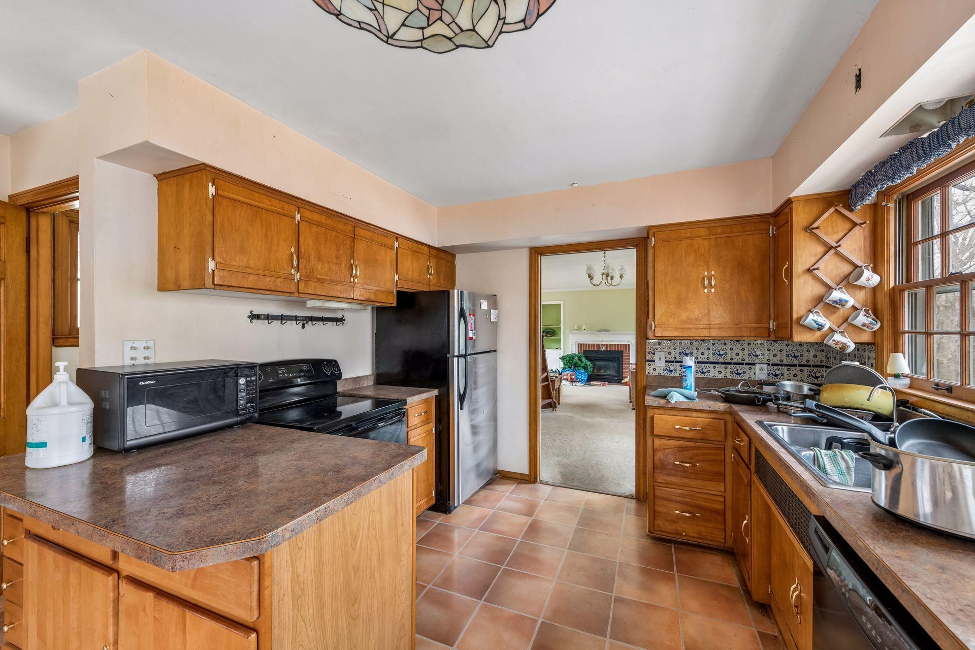 Peninsula kitchen with an east facing window