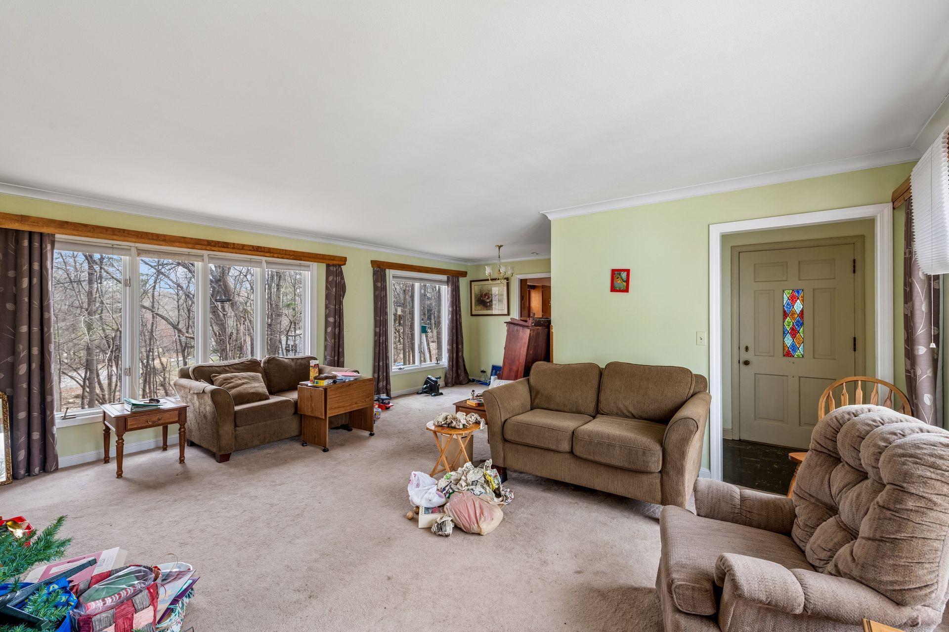 This view shows the front entrance and foyer into the living room