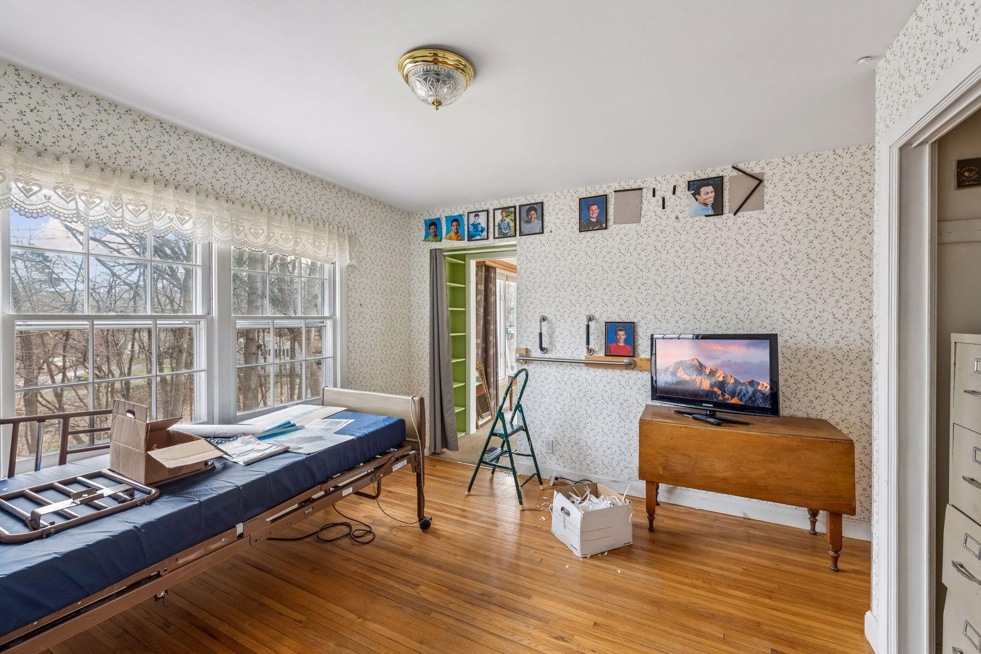 This room has hardwood floors and an east facing window