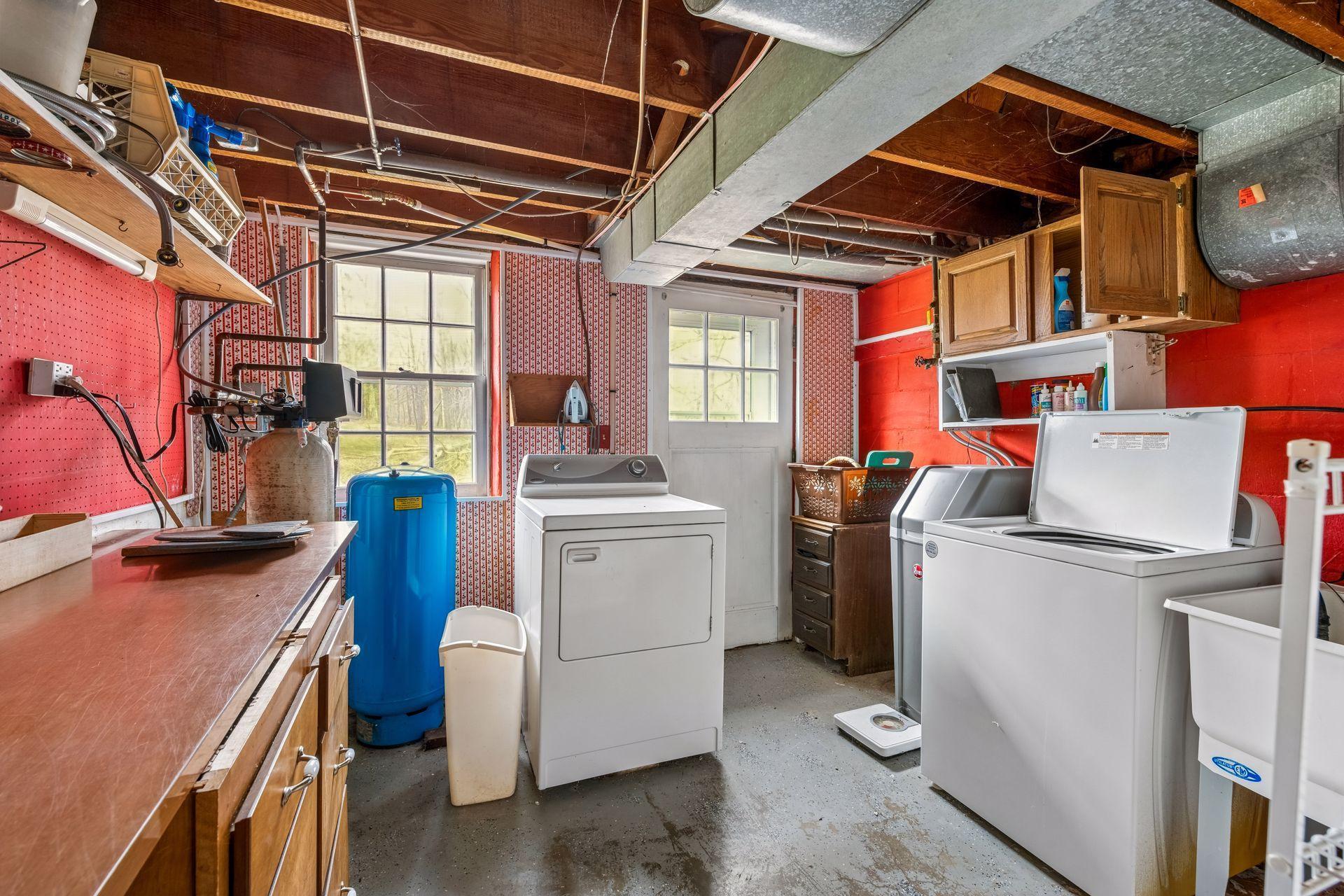 The laundry room has a door that walks out to the backyard