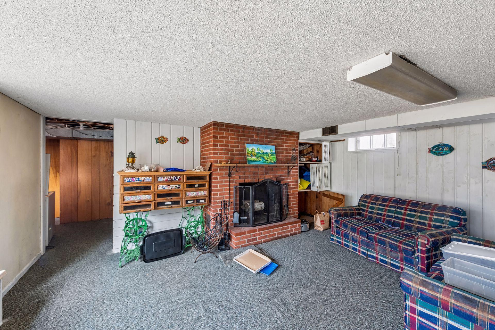 There are paneled walls and a wood burning fireplace