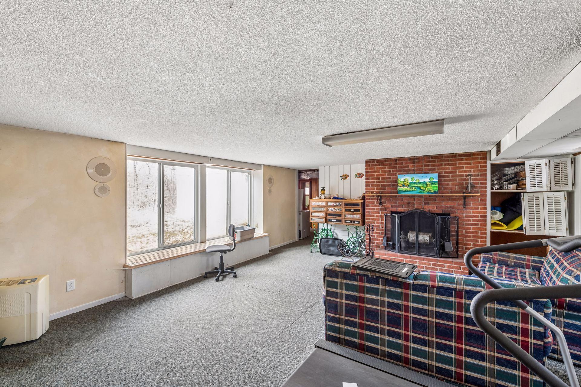 The walkout lower level family room measures 22x17