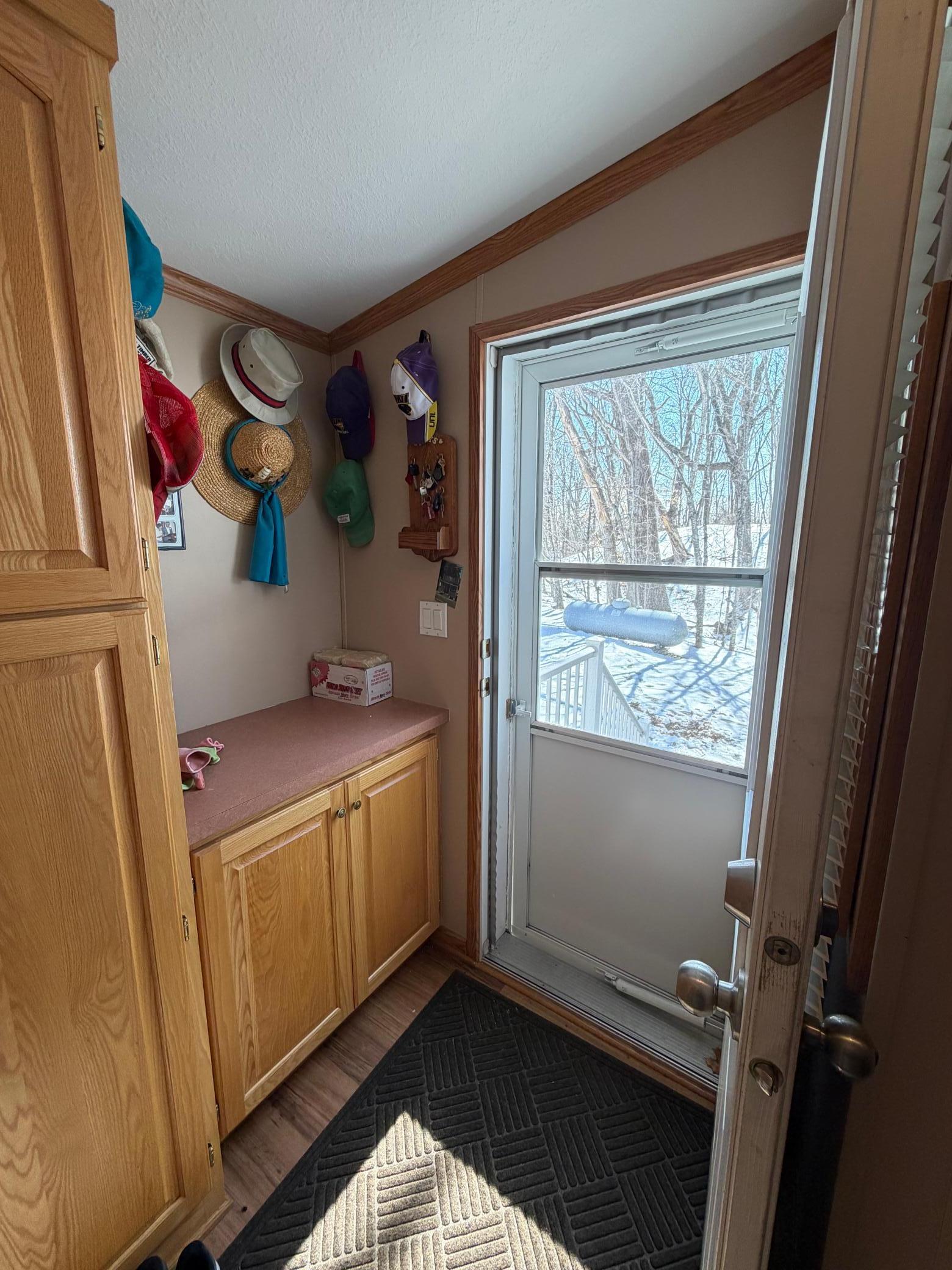 mudroom on side of home by garage