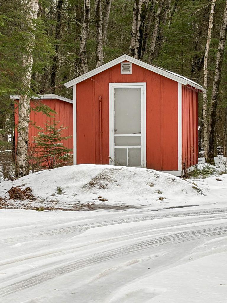 Bunkhouse/shed and outhouse.