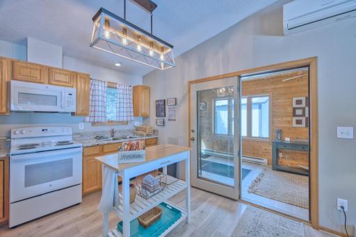 Kitchen offers new sink, stove, microwave, countertop and backsplash (2024).