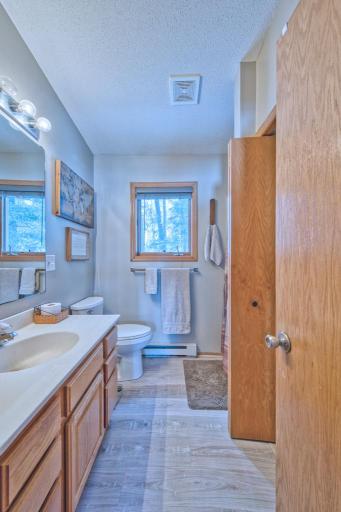 3/4 bathroom with new toilet (2024) and laundry closet.