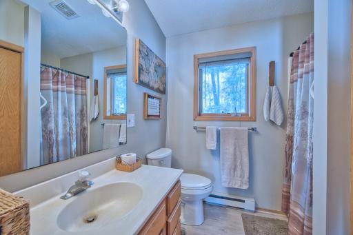 3/4 bathroom with new toilet (2024) and laundry closet.