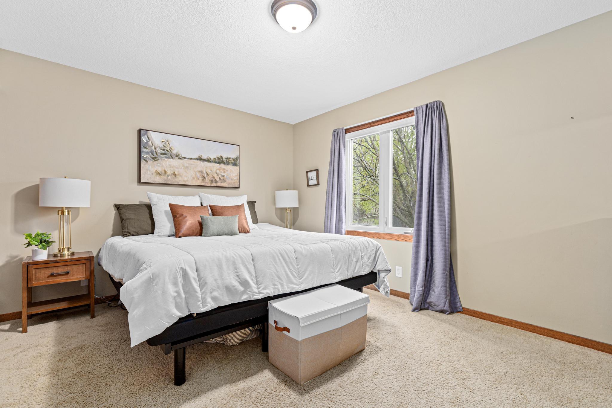 Spacious primary bedroom with natural light