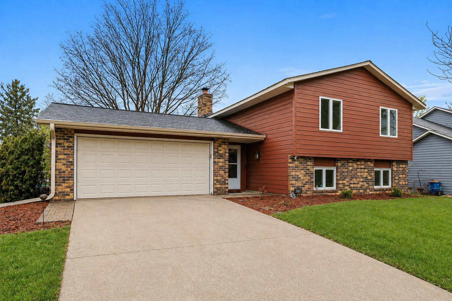 East-facing drive and two-car garage add everyday ease, even in winter.