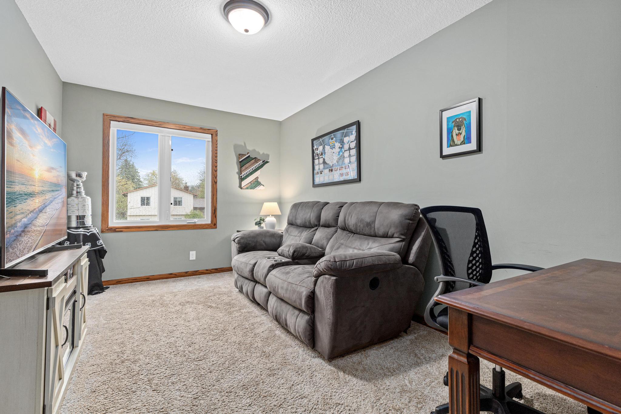 The second upper level bedroom is also perfect as a home office or additional living space