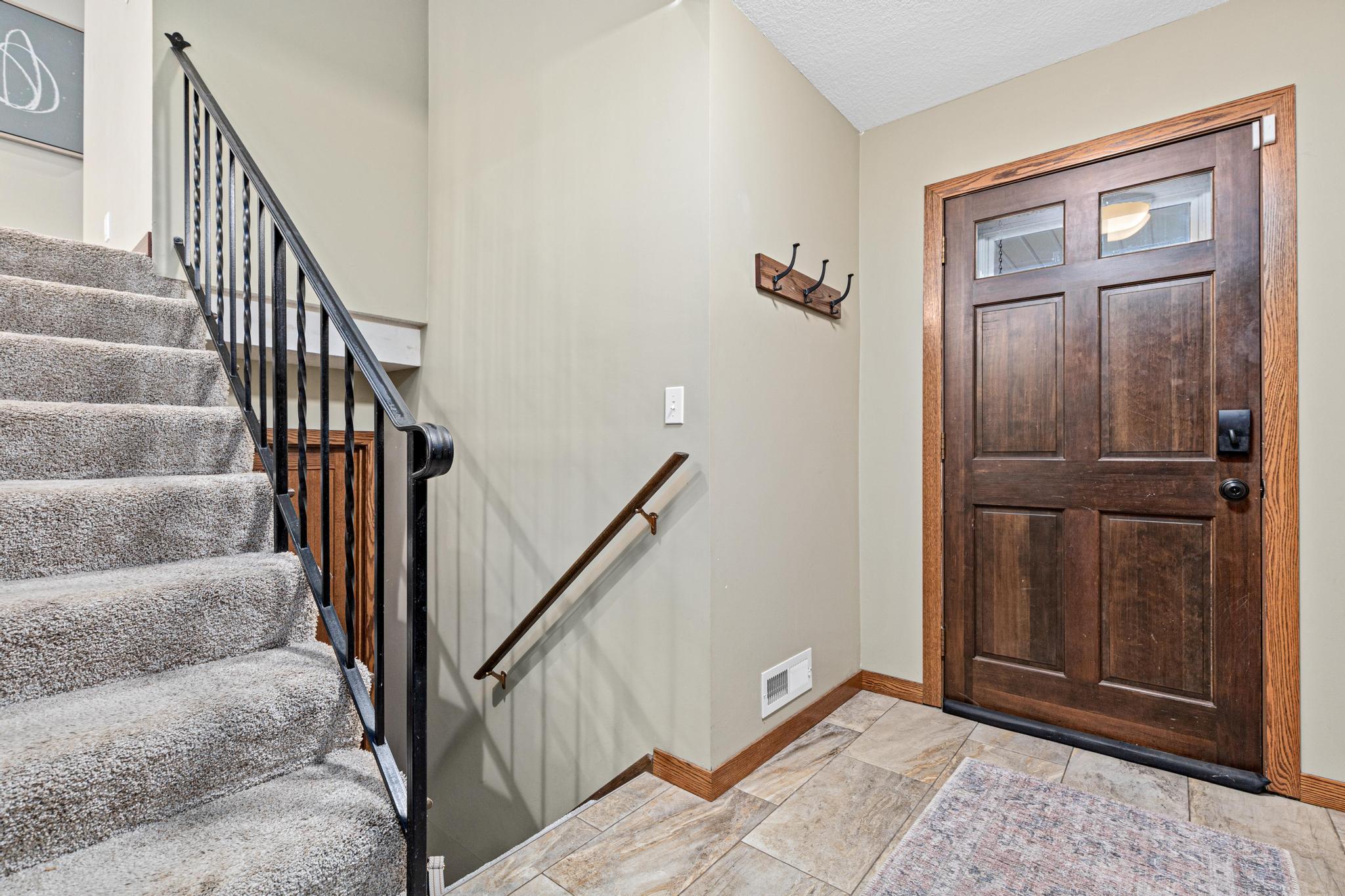 Bright, refreshed foyer offers a warm first impression.