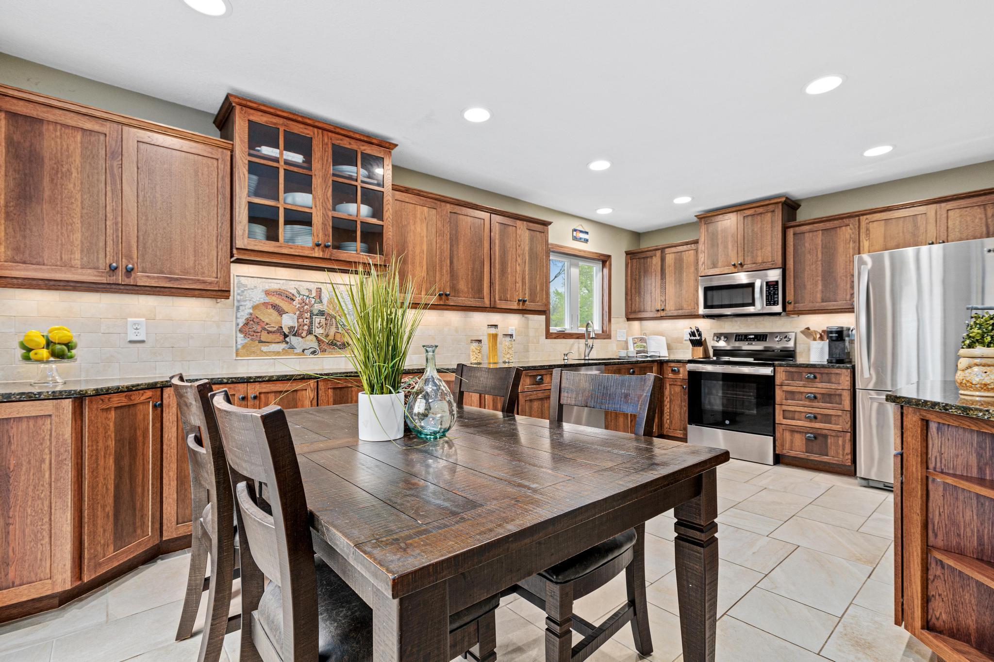 Gorgeous updated kitchen features granite counters, soft-close cabinets, and newer appliances.