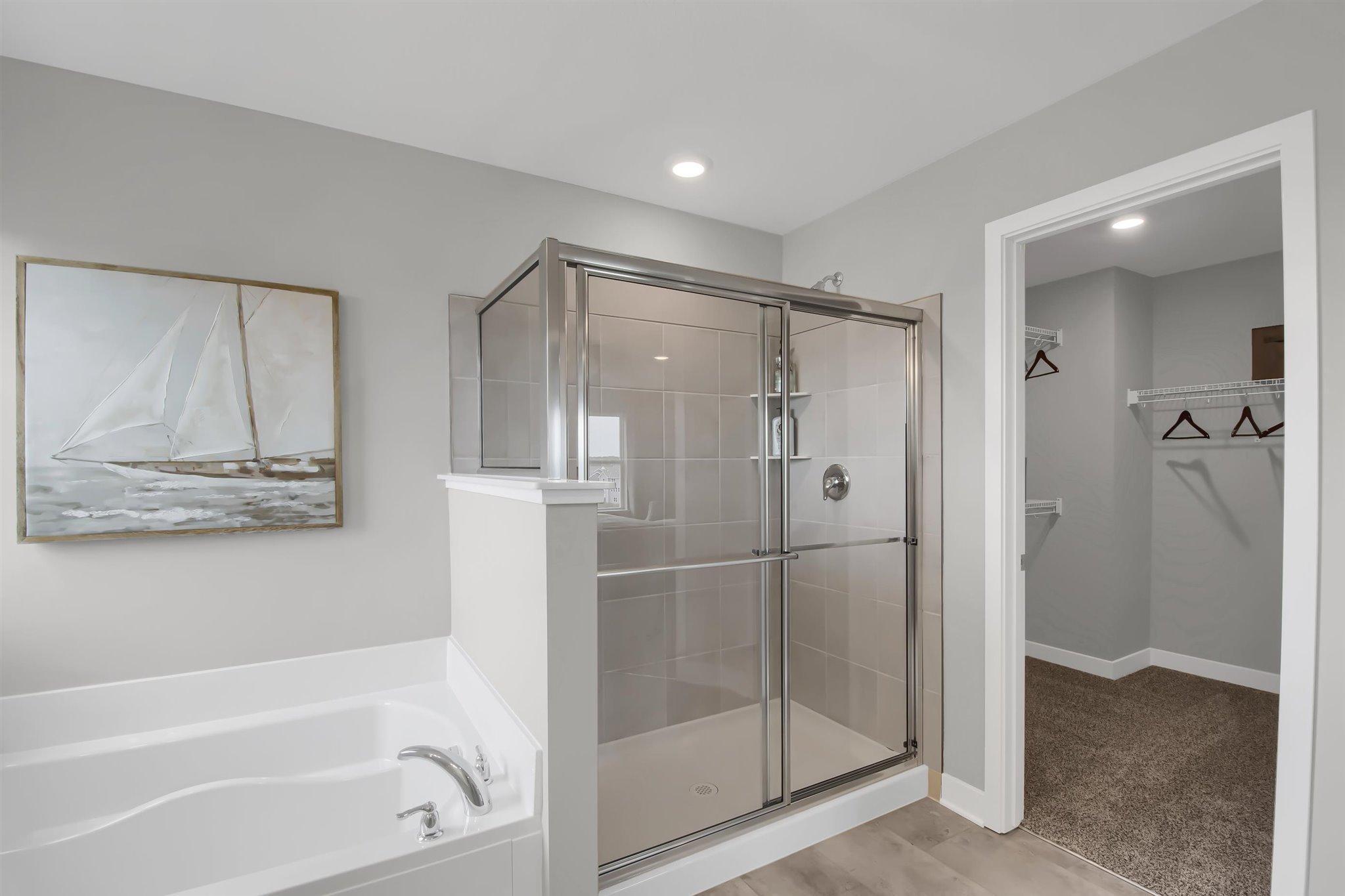 Primary bathroom with large tile shower.