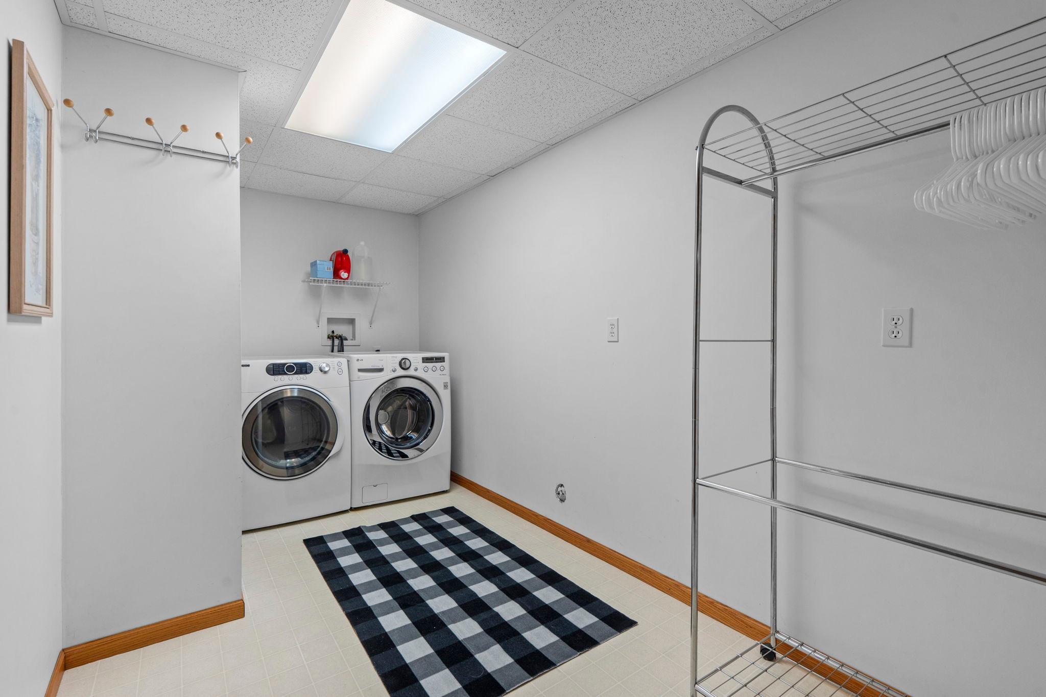 Lower level laundry room with chutes on all levels!