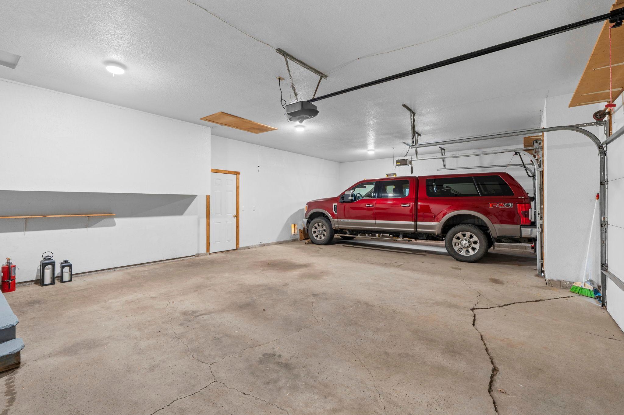 3 car extended garage that fits oversized trucks. Built in storage in large attic above the garage!