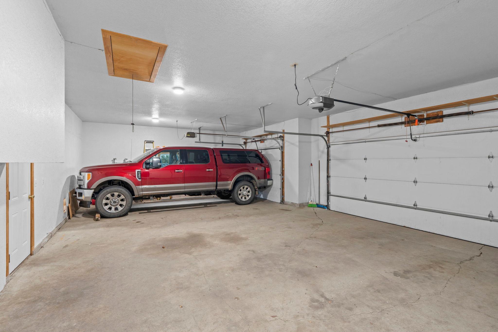 3 car extended garage that fits oversized trucks. Built in storage in large attic above the garage!