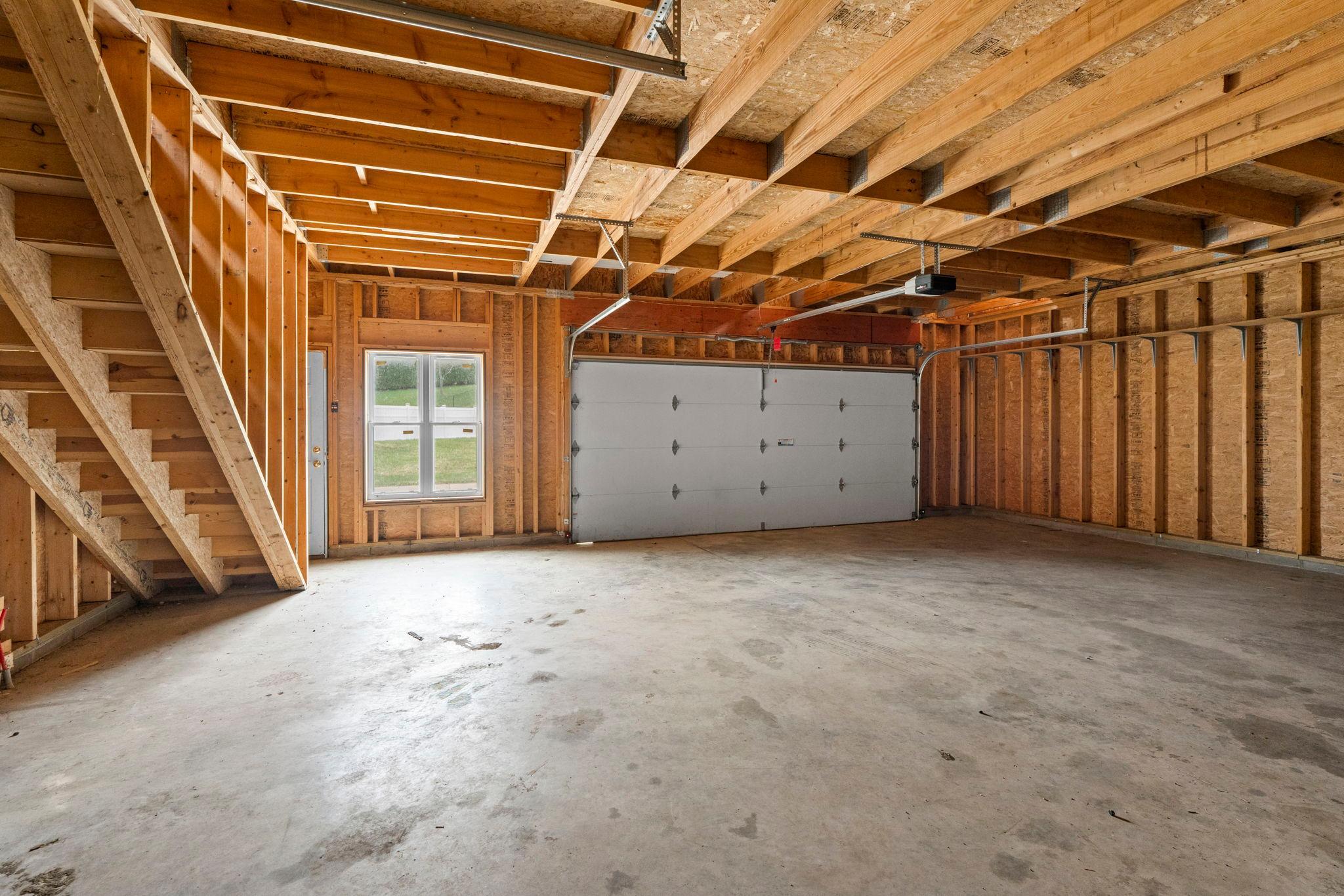 Lower level of the detached building is set up for in-floor heating! See stairs on the side leading to loft space!