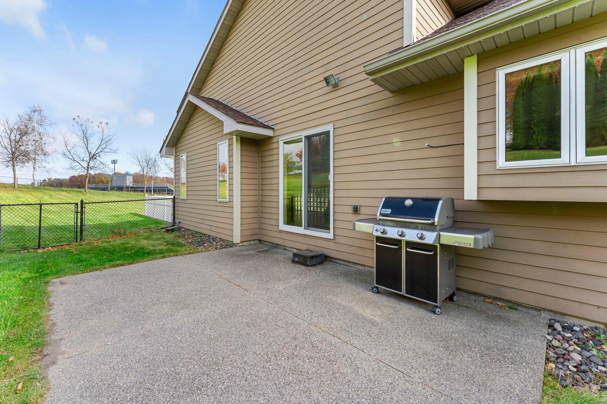 Functional patio off of dining room! Check out that large fenced in backyard behind!
