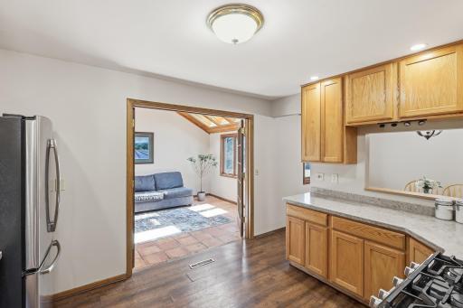 Just off the kitchen, a cozy three season porch youâll actually use