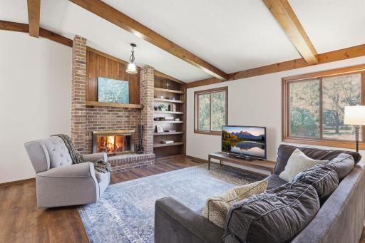 Cozy family room centered around a wood burning fireplace
