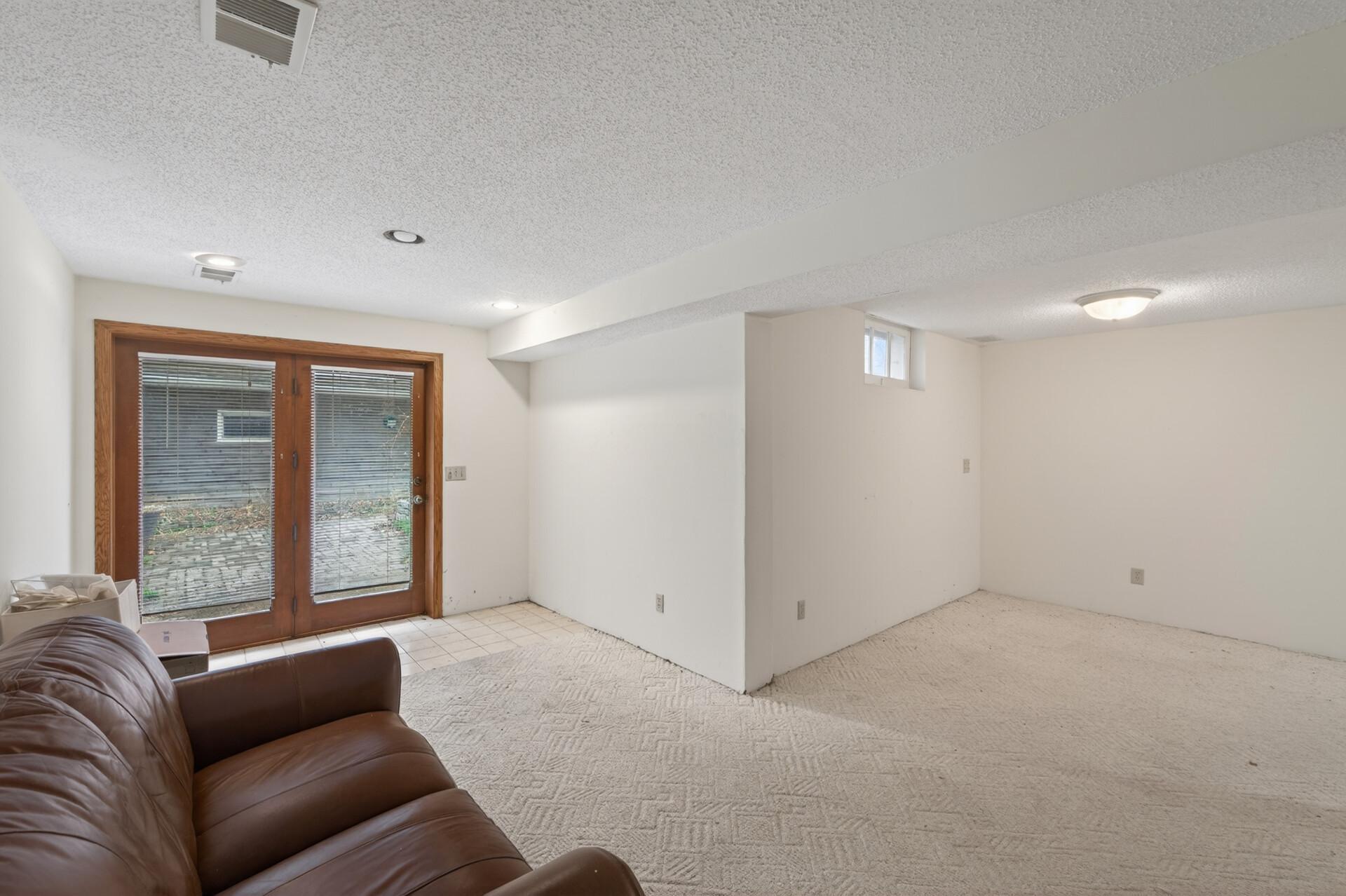 Walk-out basement leads to a paver patio