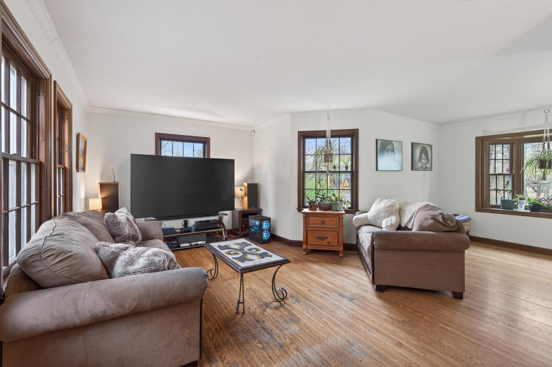 Light filled living room with room to have formal dining space