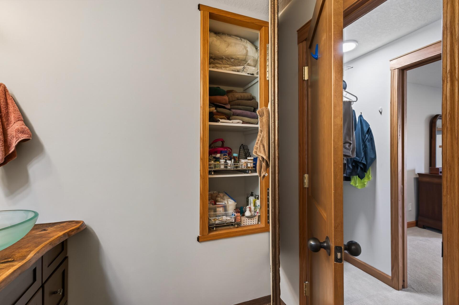 Lower level bath medicine cabinet behind mirror