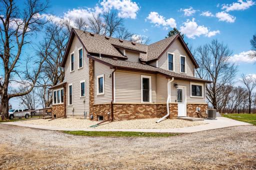 Nestled among mature trees on 5.44 peaceful acres, this charming two-story farmhouse offers just over 1,800 finished square feet of thoughtfully updated living space that blends timeless character with modern comfort.