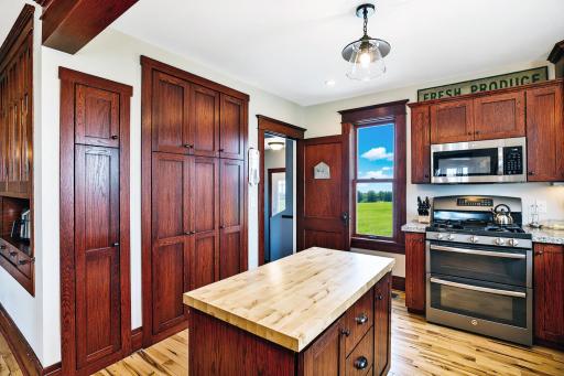 Floor-to-ceiling pantry cabinetry provides exceptional storage.