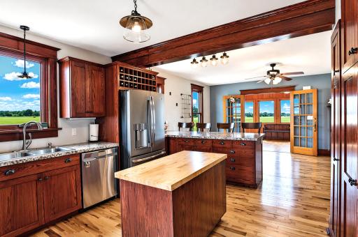 Open-concept kitchen and dining area â perfect for entertaining. Dedicated wine storage above refrigerator.