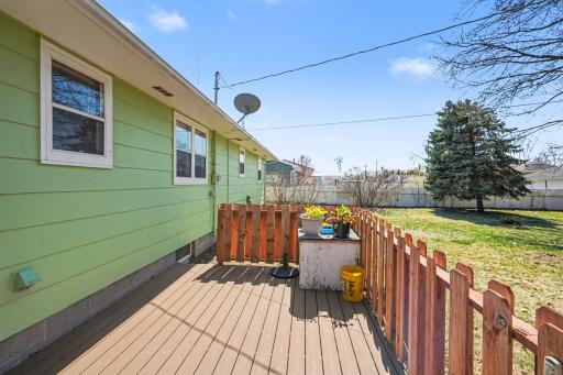 New maintenance free Trex deck with cedar rails. So cute and perfect for fun and relaxation in your fenced yard.