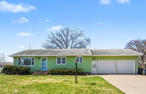 Concrete driveway with extended parking pad, big two stall attached garage with new garage doors, new garage door openers, Solid vintage work bench, attic access, and easy access to front, deck, and lower level.