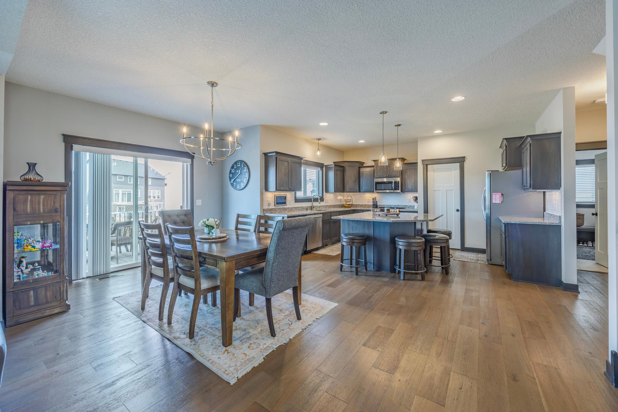 Dining area flows into the large kitchen.