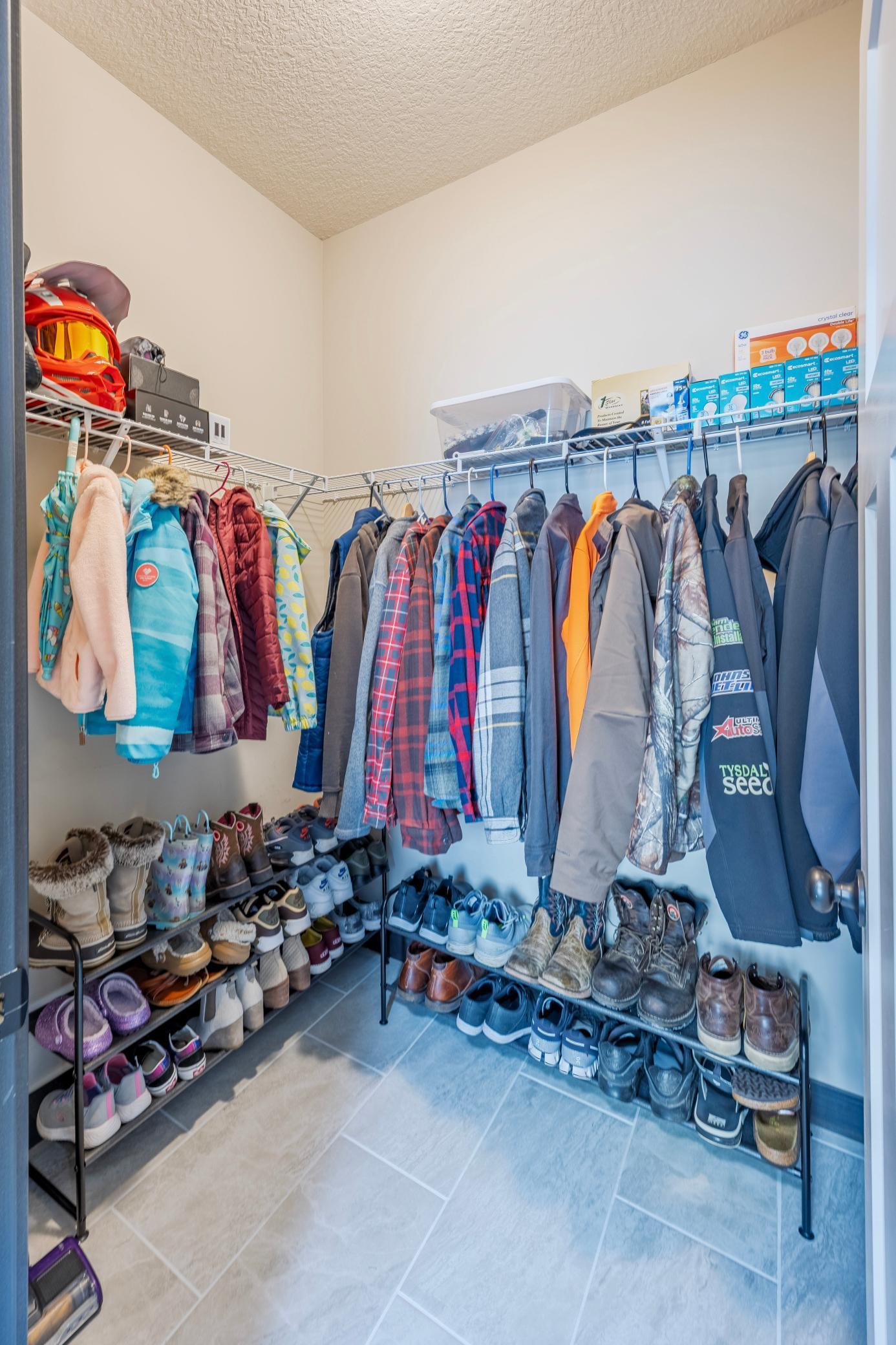 Additional closet attached to the mudroom, keeping organizing coats and shoes for the whole family a breeze!