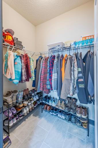 Additional closet attached to the mudroom, keeping organizing coats and shoes for the whole family a breeze!