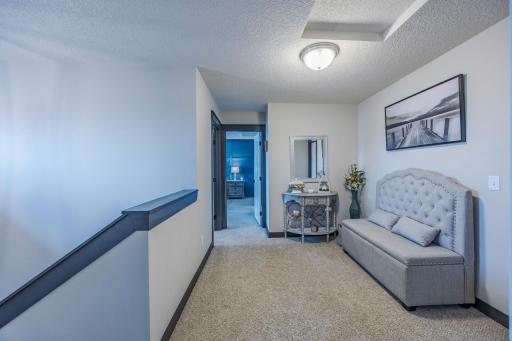 Head upstairs to find all four bedrooms plus a cozy loft.