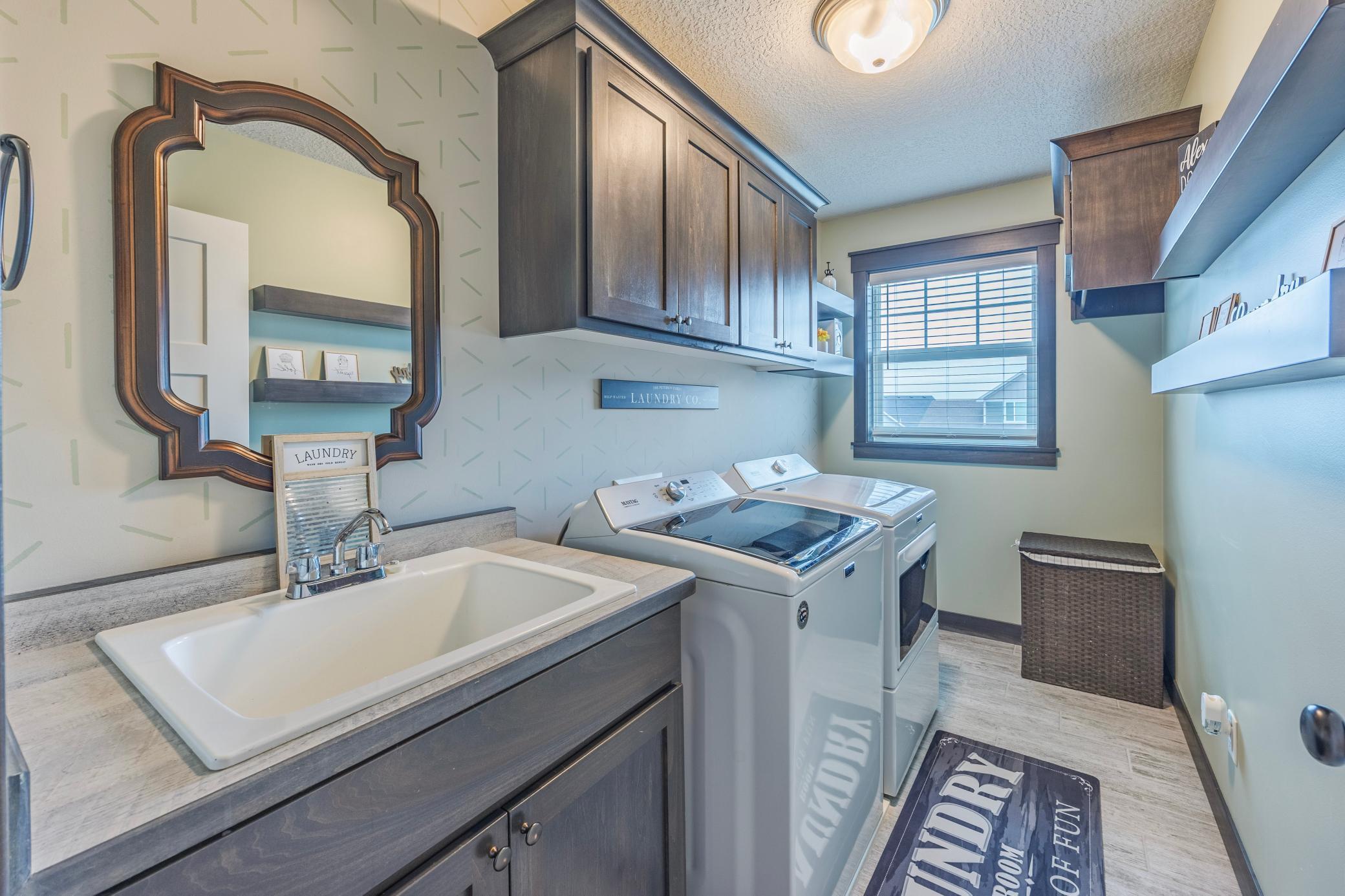 No more hauling laundry up and down stairs. Upper level laundry creates ease and comfort.