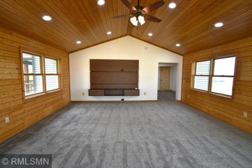 An abundance of natural light and vaulted ceilings are featured in this great room.