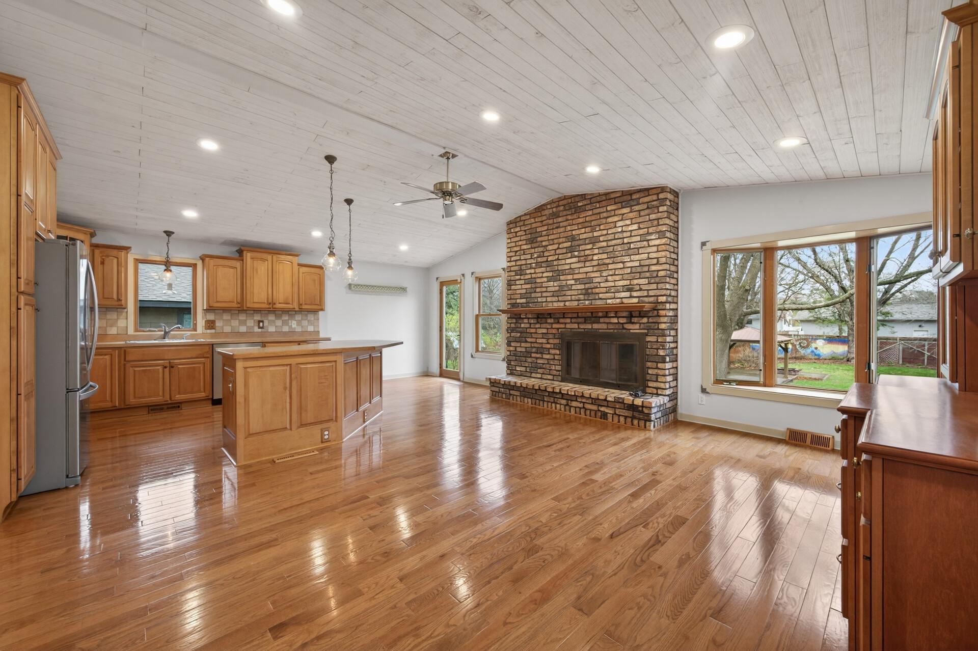 The sun-filled living room is bathed in natural sunlight, creating a warm and inviting atmosphere the moment you step inside.
