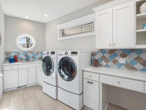 Imported tiles from Italy adds charming character to this Main Floor Laundry Room.