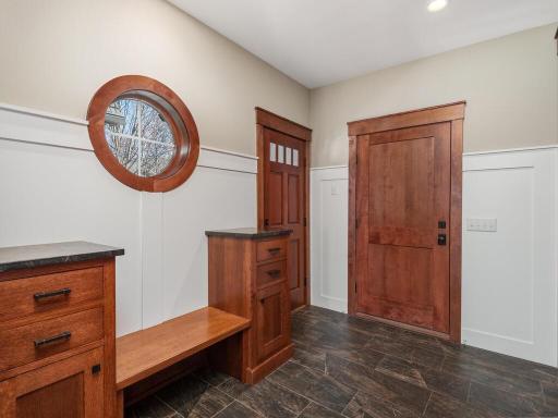 Mud Room leading to garage and upper level unfinished space.