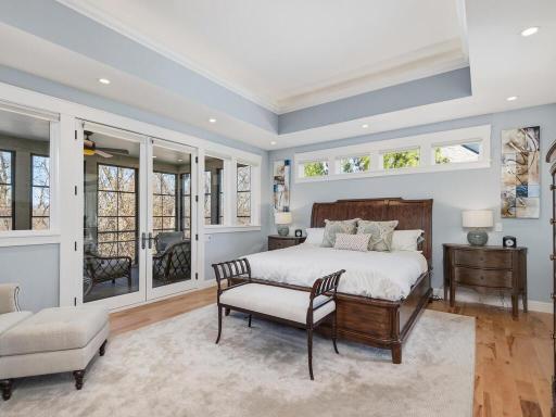 Spacious Primary Suite with French doors to screened porch.