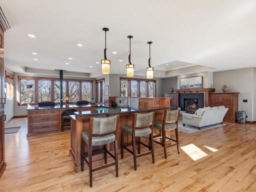 Kitchen Island with sink, cooktop, and seating on both sides perfect for entertaining guests.