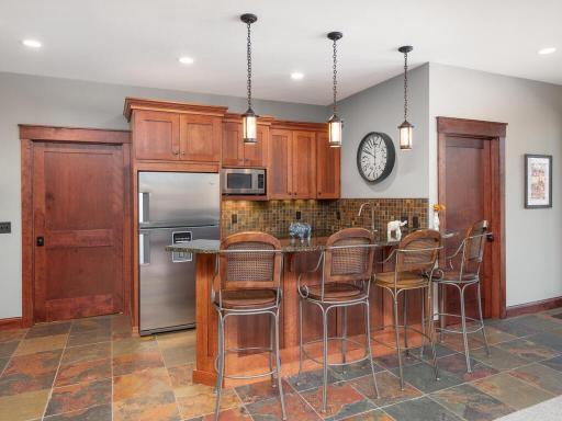 Wet Bar has dishwasher & full size refrigerator, providing full service entertaining options.