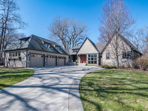 Offered for the first time! Architecturally designed Craftsman rambler on a private 1.16-acre cul-de-sac with heated driveway, surrounded by mature woods just minutes from downtown Wayzata.